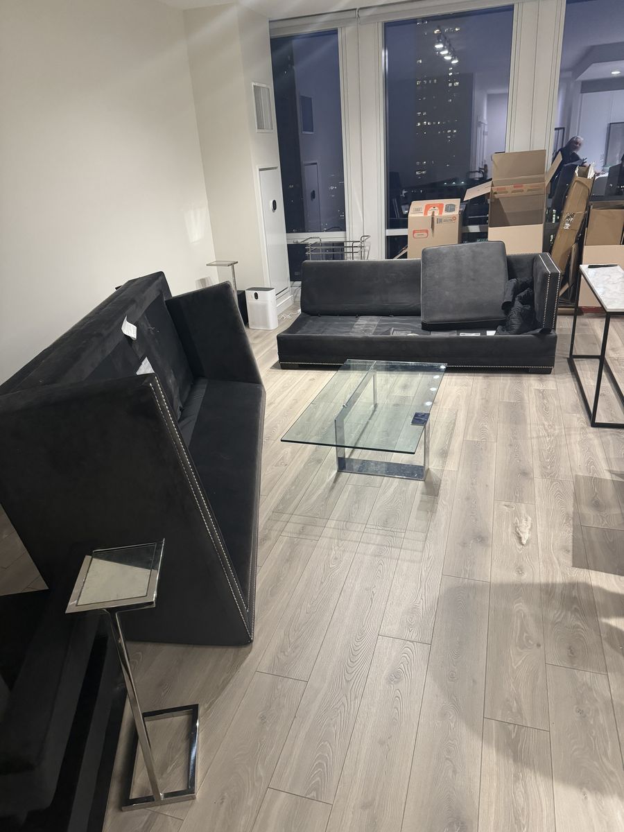 Moving boxes packed in a downtown Chicago high-rise condo during a Melendez move